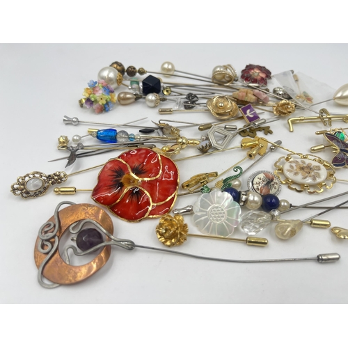 1200 - A collection of vintage hat pins and brooches