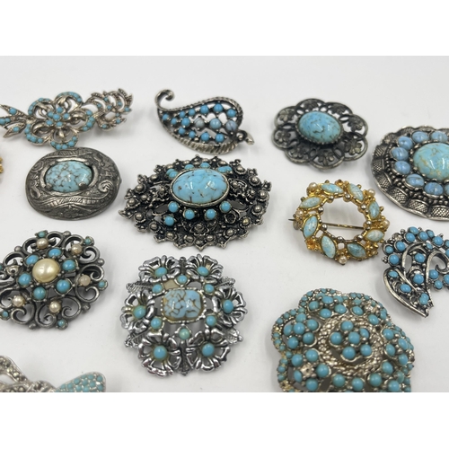 1201 - A collection of vintage turquoise brooches to include Miracle etc.