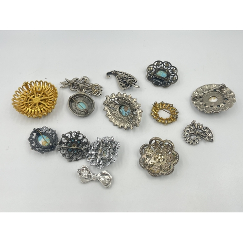 1201 - A collection of vintage turquoise brooches to include Miracle etc.