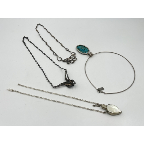 1204 - Four vintage white metal pendant necklaces to include .925 silver turquoise etc.