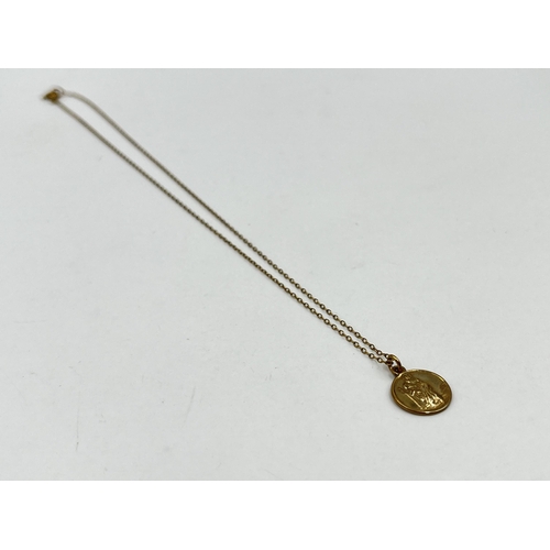 1220 - A yellow metal chain necklace with hallmarked Birmingham 9ct gold St Christopher pendant - approx. g... 