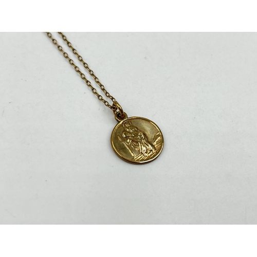 1220 - A yellow metal chain necklace with hallmarked Birmingham 9ct gold St Christopher pendant - approx. g... 