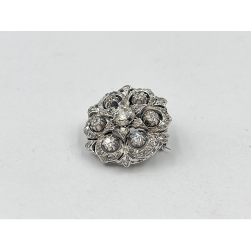 1230 - A Victorian white metal old cut diamond brooch - approx. gross weight 8.32 grams and 2.5cm diameter