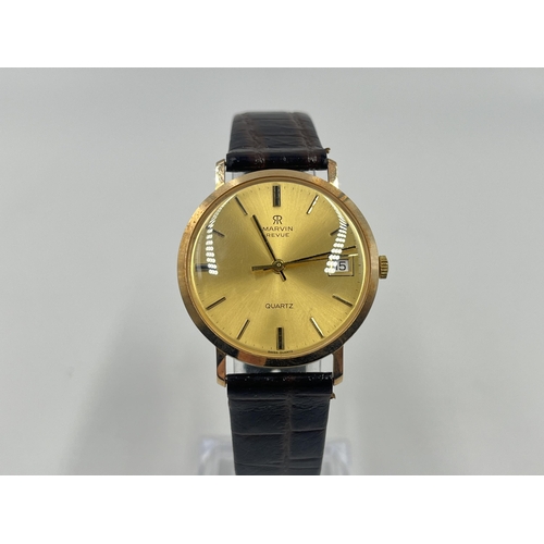 1234 - A boxed Marvin Revue 9ct gold cased quartz 33mm men's wristwatch with international guarantee - appr... 