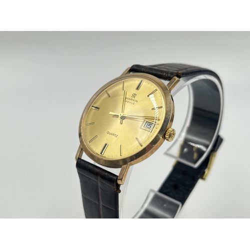 1234 - A boxed Marvin Revue 9ct gold cased quartz 33mm men's wristwatch with international guarantee - appr... 