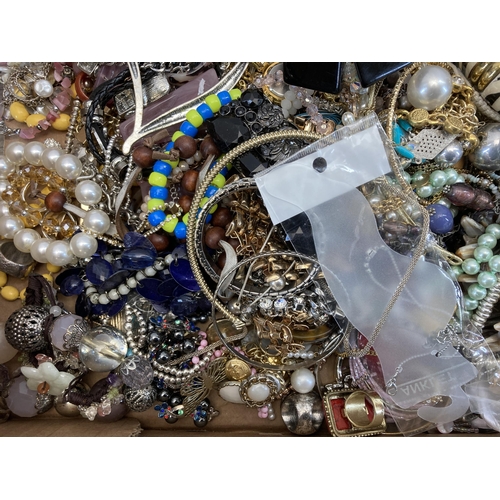 398 - A box containing a large quantity of costume jewellery