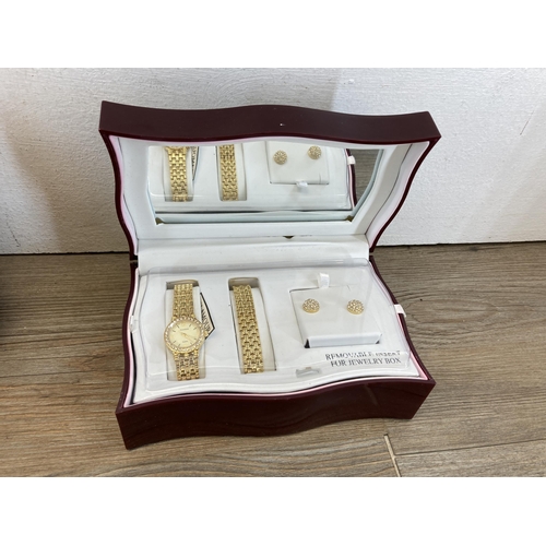 411 - A collection of items to include Accurist quartz wristwatch, boxed watch bracelet and earrings set, ... 