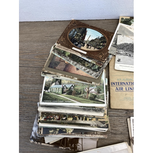 413 - A collection of vintage post and cigarette cards to include John Player & Sons Aircraft of The Royal... 