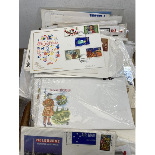 416 - A collection of First Day Covers to include Melbourne Victoria Australia, charity stamp, British Fai... 