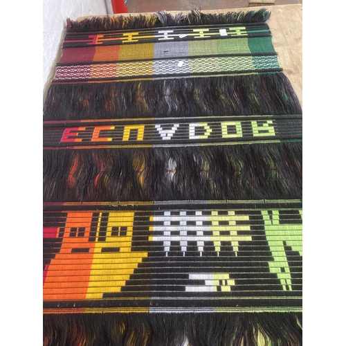 432 - An Ecuadorian woven and sewn cotton wall hanging - approx. 146cm long x 68cm wide