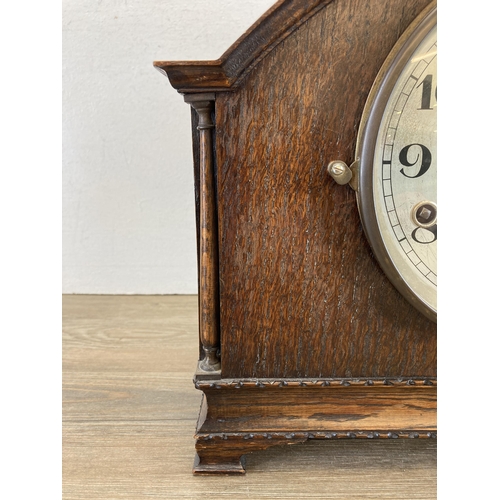 446 - An early/mid 20th century oak cased chiming mantel clock - approx. 28cm high x 36cm wide x 17cm high