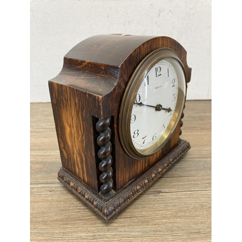 450 - An early 20th century French Bayard mantel clock with carved oak case