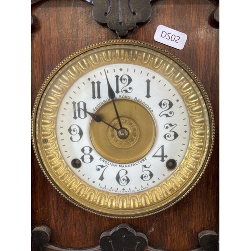 453 - An early 20th century Fattorini & Sons Bradford heavily carved oak cased chiming mantel clock with e... 