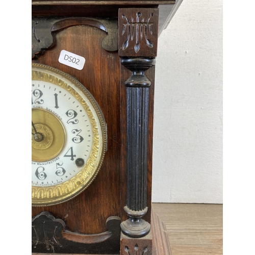 453 - An early 20th century Fattorini & Sons Bradford heavily carved oak cased chiming mantel clock with e... 