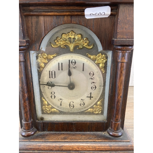 455 - A 19th century Black Forest Company oak cased chiming mantel clock with pendulum - approx. 23cm high... 