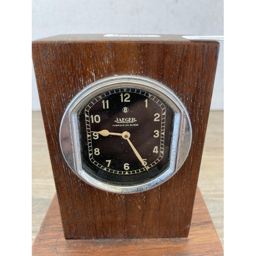 456 - A mid 20th century Jaeger dash clock in later added oak case - approx. 14cm high x 11cm wide x 7cm d... 