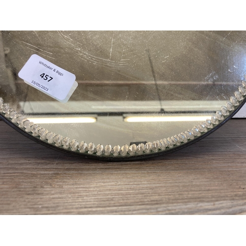 457 - An early/mid 20th century mirrored tray with pewter rim and bevelled edge - approx. 28cm diameter