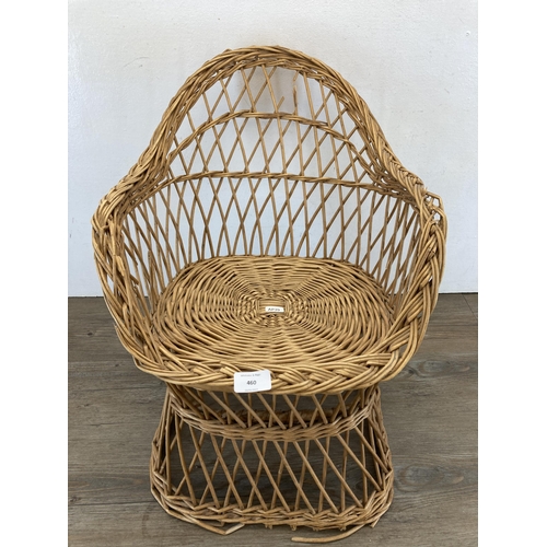 460 - A mid 20th century wicker child's chair - approx. 51cm high