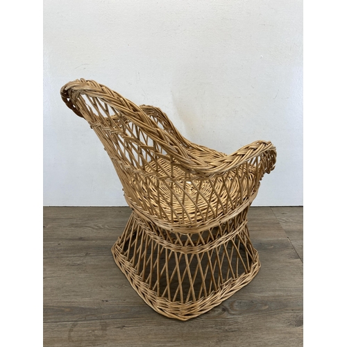 460 - A mid 20th century wicker child's chair - approx. 51cm high