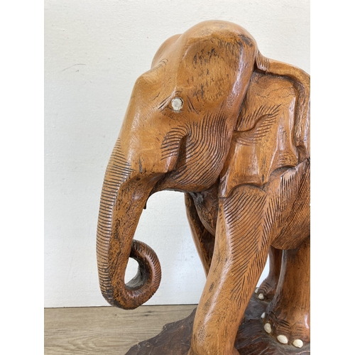 467 - A carved oak elephant sculpture - approx. 51cm high x 41cm long