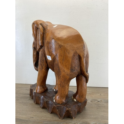 467 - A carved oak elephant sculpture - approx. 51cm high x 41cm long