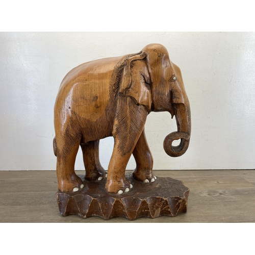 467 - A carved oak elephant sculpture - approx. 51cm high x 41cm long