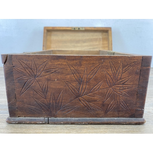 474 - A late 19th/early 20th century Oriental carved oak rectangular storage box with dragon scene to lid ... 