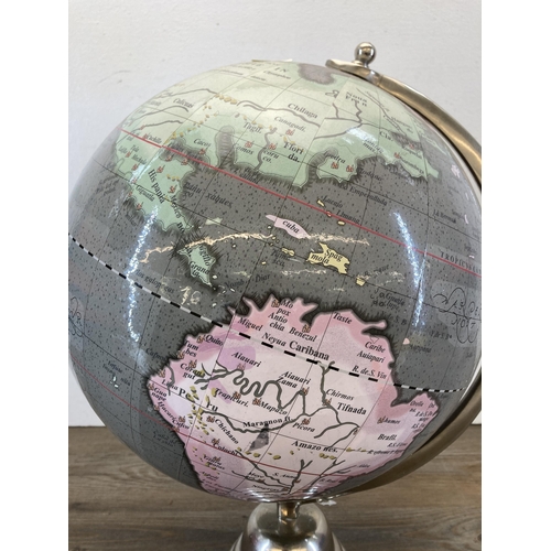 485 - A chrome plated terrestrial globe - approx. 45cm high