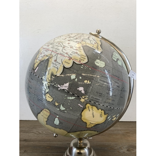 485 - A chrome plated terrestrial globe - approx. 45cm high