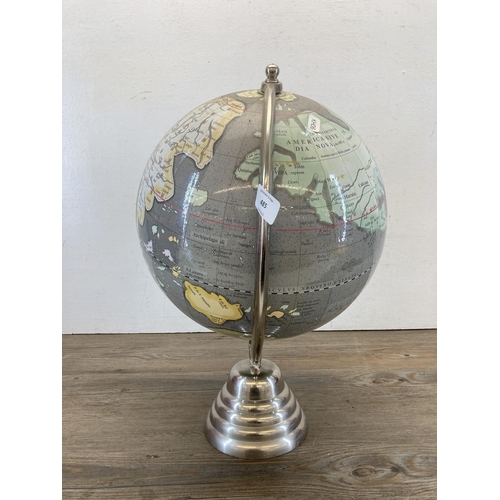 485 - A chrome plated terrestrial globe - approx. 45cm high