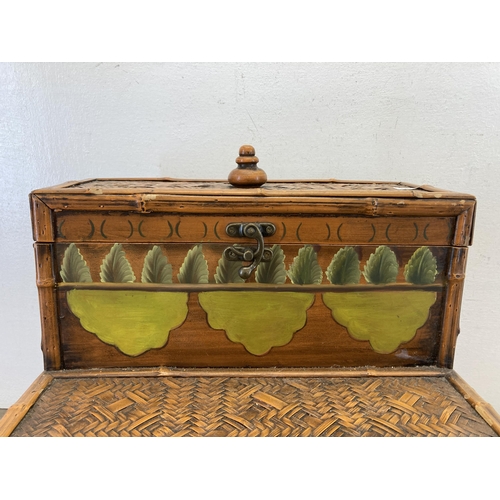 501 - An Oriental style bamboo and wicker two step storage box - approx. 40cm high x 36cm wide x 26cm deep