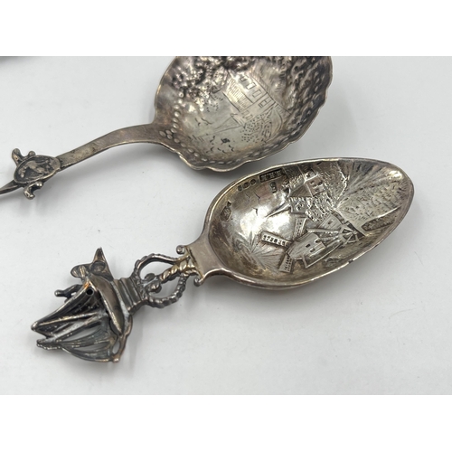 1253 - Three silver collector's spoons, one .925 with windmill and nautical scene, one .830 and one Dutch .... 