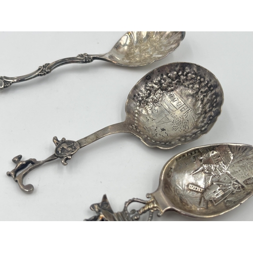 1253 - Three silver collector's spoons, one .925 with windmill and nautical scene, one .830 and one Dutch .... 