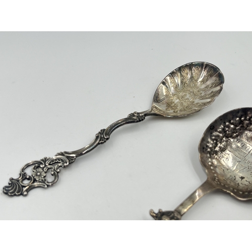 1253 - Three silver collector's spoons, one .925 with windmill and nautical scene, one .830 and one Dutch .... 