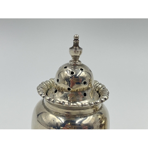 1314 - A pair of Edwardian Vale Brothers & Sermon sterling silver tri footed pepper shakers, hallmarked Che... 