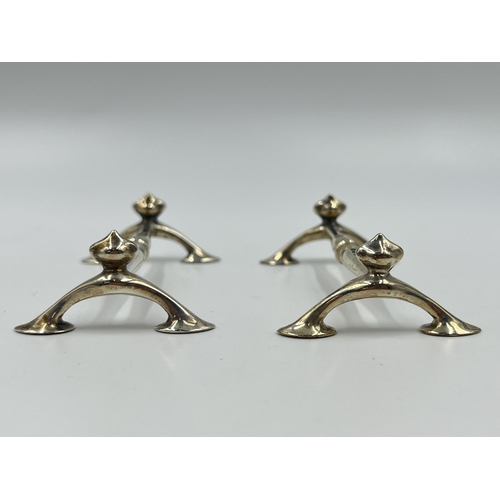 1316 - A pair of Edwardian William Hutton & Sons Ltd sterling silver knife rests, hallmarked Sheffield 1910... 