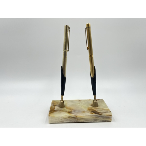 1349 - A mid 20th century onyx double pen stand with seven pens and pencils to include Life-Long rolled gol... 