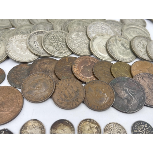 1358 - A collection of coins to include fifty-six 50% silver half crowns - approx. gross weight 774 grams, ... 