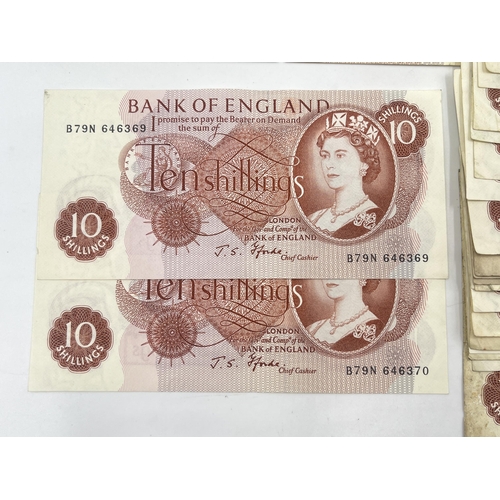 1376 - A collection of approx. eighty-five 1960s Bank of England 10 shilling notes, two with consecutive se... 