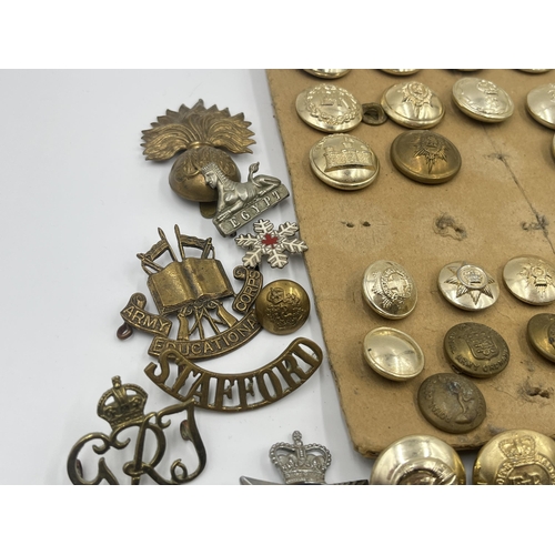 1387 - A collection of military buttons and cap badges to include The Royal Highlanders Blackwatch, Royal E... 