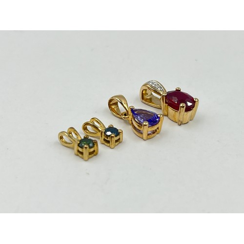 1022 - Four 9ct gold gemstone set pendants, one enhanced blue diamond, one enhanced green diamond, one glas... 