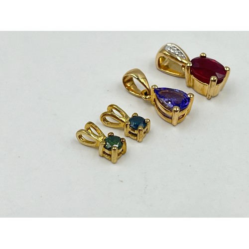 1022 - Four 9ct gold gemstone set pendants, one enhanced blue diamond, one enhanced green diamond, one glas... 