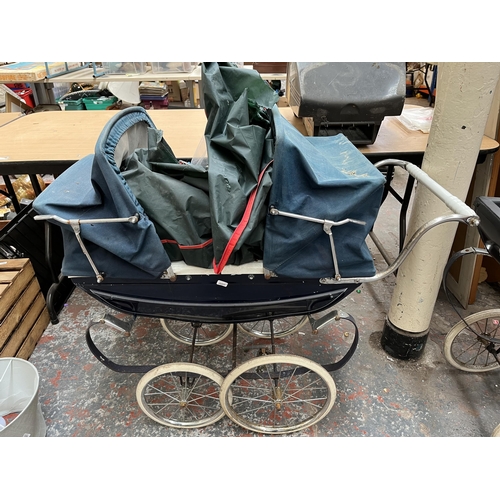 742 - Two mid 20th century Silver Cross style prams to include one containing toys etc.