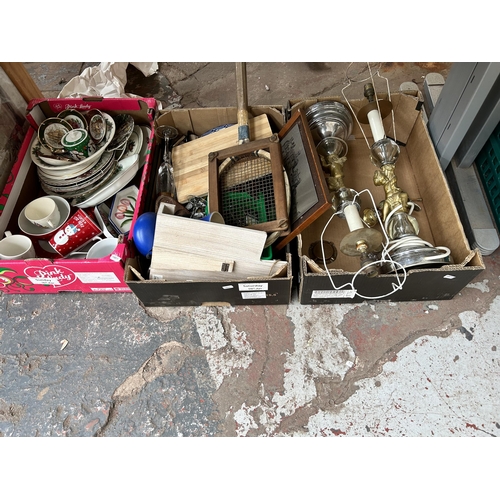 791 - Nine boxes containing lamps, vintage tennis racket, tambourine, glassware, cased cutlery and ceramic... 