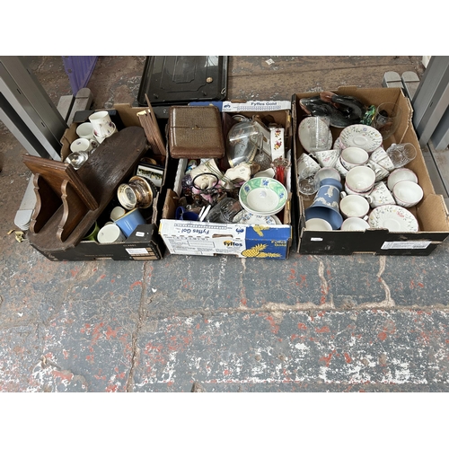 791 - Nine boxes containing lamps, vintage tennis racket, tambourine, glassware, cased cutlery and ceramic... 