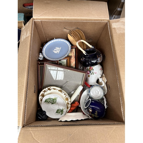 796 - Two boxes containing picture frames and ceramics to include Beswick, Shelley, Wedgwood, Coalport etc... 