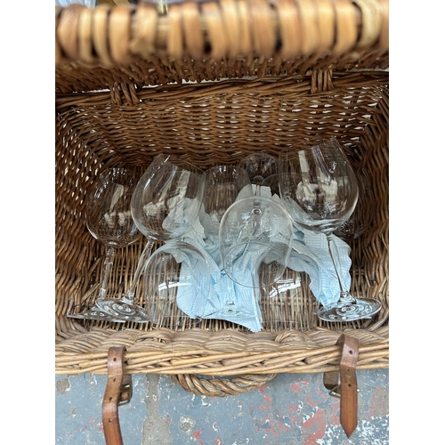 800 - Seven items to include wicker picnic basket containing large wine glasses, oval mirror, table lighte... 