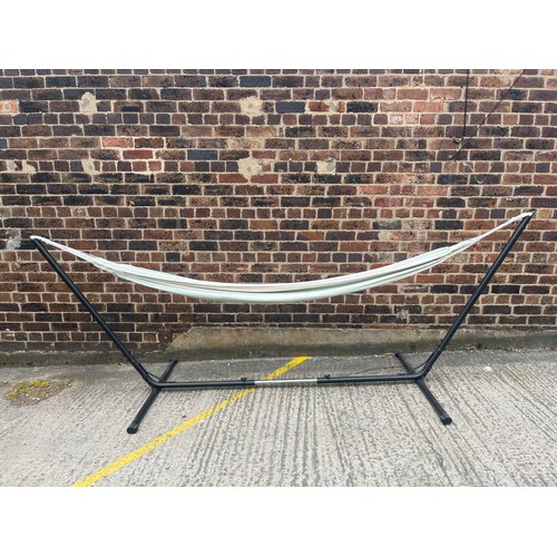 632 - A metal framed canvas hammock