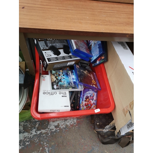 749 - A large collection of house clearance items to include DeWalt stack tool box, PlayStation games, DVD... 