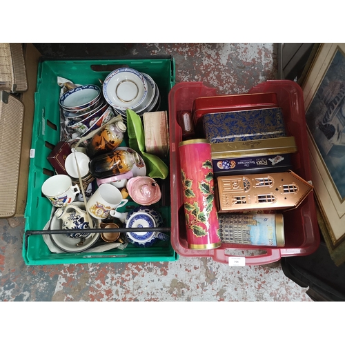 754 - Five boxes containing collectable tins, ceramics, glassware, silver plated items etc.